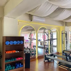 Our equipment is neatly organized and accessible. This corner features stability balls, hand weights, and other props we incorporate into sessions to add variety and challenge.