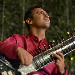 Looking up in a moment of musical immersion during an outdoor performance.