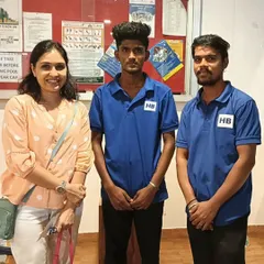 Two of our team members posing with a happy client, reflecting the friendly and positive relationships we build.