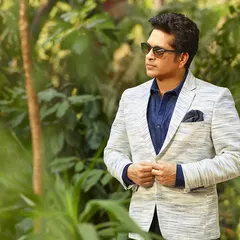 Photographing an icon like Sachin Tendulkar requires capturing both the sportsman and the gentleman. This portrait, set against a natural backdrop, showcases his dapper style and calm, focused demeanor off the field.