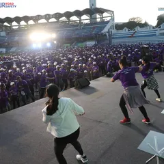 Leading the warm up session from the main stage at Kanteerava Stadium. Getting the crowd's energy up before a big race is a crucial part of my role as a marathon host.