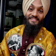 A closer look at the honor. The portraits I wear are of the great musicians M.S. Subbulakshmi and Bismillah Khan, paying homage to the legends of our music.