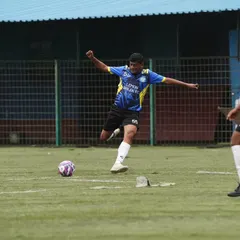 A player unleashes a powerful shot during a competitive league match. We play with full intensity, proving that passion for football has no age limit.
