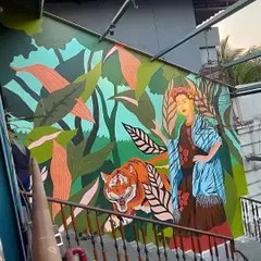A full shot of our Frida Kahlo mural at 1522 Mumbai. The composition balances the iconic artist with a powerful tiger and lush foliage, creating a narrative of strength and nature that we designed specifically for the space.