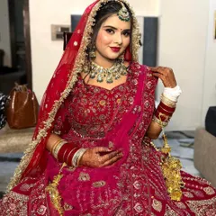 My bride Nikita looking absolutely stunning in her red lehenga. Her smile shows how happy and confident she felt with her soft glam makeup.