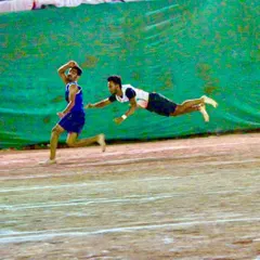 A perfectly timed dive to tag the runner. This image captures the split-second decisions and commitment required in Kho-Kho.
