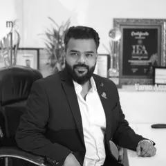 A professional black and white portrait of me, Yogesh Gupta. I am passionate about capturing your unique love story.