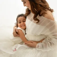 Welcoming a new baby is a family affair. I love including older siblings in my sessions, capturing these precious moments of bonding before the family grows. This sweet hug is a memory they'll both cherish forever.