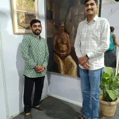 Standing with my award-winning painting "Contrast of life" at the 36th All India Lokmanya Tilak Exhibition in Pune.