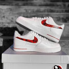 A clean, sharp look for these custom Nike Air Force 1s. We painted a red and black geometric pattern inspired by MotoGP racing on the swoosh and midsole for a subtle but stylish design.