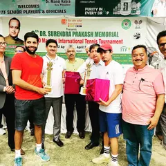 Receiving the winners' trophies at the ITF 400 Masters International Ranking Tournament. We believe in leading from the front by competing at the highest level.
