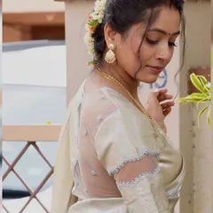 A detailed view of the sheer back blouse I got custom-made to recreate actress Sneha's look. The design features delicate embroidery on the net fabric, creating an elegant and modern feel for a traditional saree.