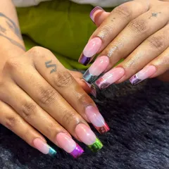 A rainbow at your fingertips. This design puts a colorful spin on the French manicure with multi-colored chrome tips on long, square-shaped extensions. It's a fun and vibrant way to wear a classic style.