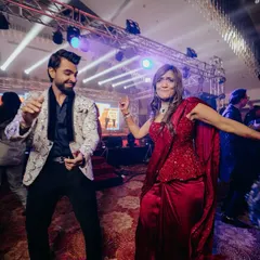I don't just stay on the stage; I get on the dance floor with your guests. This is me joining the celebration, ensuring everyone feels the beat and becomes a part of the party. An interactive wedding host makes all the difference.