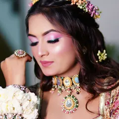 The eye makeup for the Mehendi look is bright and shimmery, making the eyes the center of attention.