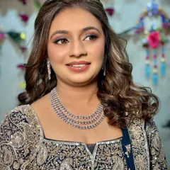 A close-up of the sangeet makeup, highlighting the blended smokey eye and the radiant skin finish.