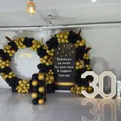 I also handle corporate and milestone celebrations. For this event celebrating '30M', I created a large balloon installation in black and gold, with custom signage and large marquee numbers.