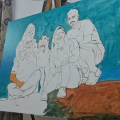 Here, the initial sketch for a family group portrait is complete, and I have begun blocking in the background colors. This layering technique helps to create depth and atmosphere in the final piece.