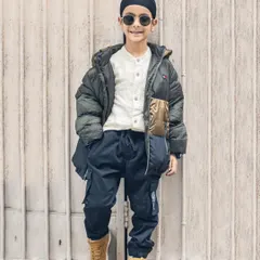 A full-length shot of this stylish young boy during his outdoor photoshoot. He looks like a professional model!