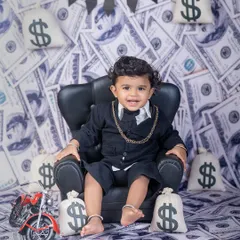 Meet the little boss man! My "Boss Baby" theme is always a hit, perfect for capturing that big personality in a tiny package. With a custom money-themed backdrop and props, we create memories that are both fun and unforgettable.