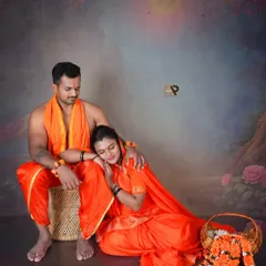 A serene and romantic moment from our Seetha-Ram inspired maternity collection. The couple rests together against a painted backdrop of a moonlit forest, creating a peaceful and artistic scene.