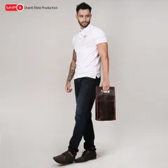 We capture accessories from multiple angles, as seen with this male model holding a leather utility bag. This helps highlight the product's handle and portability.