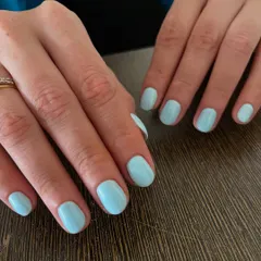 Blue skies on your fingertips. A beautiful, clean manicure in a solid pastel blue gel polish is a perfect way to add a touch of color in a simple, chic way.