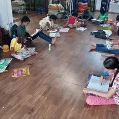 This is our drawing class in full swing. Each student is absorbed in their own creative world, whether they are sketching, coloring, or working on a detailed composition.
