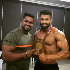 With my uncle, Kitty Murthy, after my Mr. Asia 2019 win. He is more than a coach; he is family. I owe my success to his unwavering support and mentorship.
