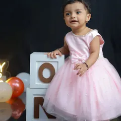 Before the cake smash begins, I always capture some clean, classic portraits. This little girl in her pretty pink dress, standing by the 'ONE' blocks, looks like a true birthday princess.