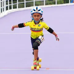 Focus and form. My daughter in her racing gear, showing great posture and determination. We teach these core skills to all our beginner skaters.