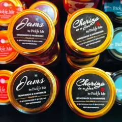 A top-down view of our Jams and ready-to-eat Chorizo in a Jar. We ensure every lid is sealed with care, locking in the homemade freshness.