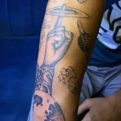 Another view of the cosmic sleeve, showing how different shaded and line-work elements like Saturn and Earth come together to form a cohesive piece.