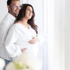 Looking towards the future together. The soft, natural light in my studio is perfect for creating bright, airy, and hopeful maternity portraits like this one.