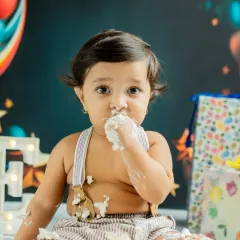 The pure joy of a first taste of birthday cake. I focus on capturing these genuine, unscripted moments during the cake smash session, resulting in photos full of personality and fun.