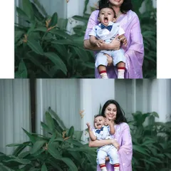 A candid mother and son portrait from a birthday celebration. The little boy, dressed in a cute bow tie, is yawning and laughing in his mother's arms, showing a real and funny family moment.