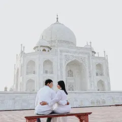 There is nothing more iconic than a pre-wedding shoot at the Taj Mahal. I focus on finding unique perspectives that frame this monument to love as a quiet backdrop to your own story, creating a timeless and elegant couple portrait.