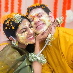 Dipped in sunshine and smeared with love. The Haldi is all about these candid moments of pure joy, where the couple can be playful and carefree. The genuine smiles and laughter are what make these frames so precious.