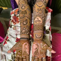 This design shows how to create different scenes on each hand while maintaining a cohesive theme, featuring dancing figures and traditional motifs.