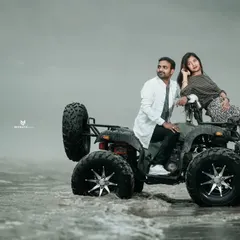 A stylish shot of a couple posing with an ATV in the misty river. This is a great option for a unique and adventurous pre-wedding theme.