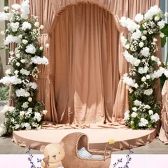 For a classic and intimate baby shower, we used a soft Mocha Mousse color palette to create a world of gentle sophistication. Layers of custom drapes and delicate white florals came together to wrap the celebration in calm, grace, and warmth.