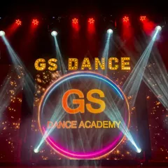 The stage I designed for the GS Dance Academy's 11th annual show. It features a custom neon-style logo, marquee letters, and dramatic spotlights to create a high-energy, professional look for the performances.