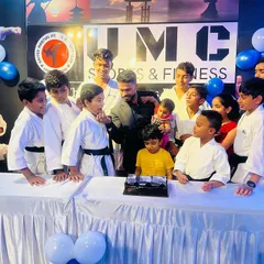 A celebration with cake for our new black belts. We believe in celebrating every major achievement as a team.