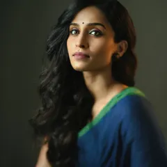 This shot has the feel of a classical painting. The simple composition, soft lighting, and the model's serene pose come together to create a portrait that is both elegant and powerful in its simplicity.