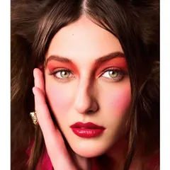 A beauty editorial close-up for Vigour Magazine. The focus here was on the bold, red-toned makeup, using light to accentuate the model's striking green eyes and flawless skin.