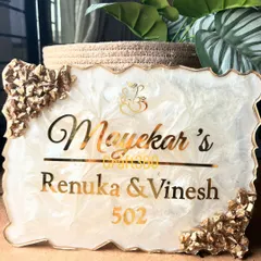 A classic and elegant nameplate design that is one of my most requested styles. I created this piece with a white and gold marble effect, accented with geode crystals, to give the entrance a feeling of warmth and luxury.