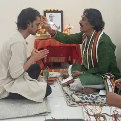 Receiving the traditional 'tilak' from my Guruji. This gesture signifies the passing of knowledge and blessings from the teacher to the student.