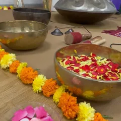A beautiful setup with flowers and singing bowls for a sound meditation class at Comcast in Chennai. We conducted over 12 batches in one day to help employees let go of stress.