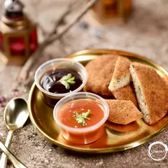 These Chicken Minced Cutlets are crispy on the outside and packed with flavorful, spiced minced chicken on the inside. They are served with tangy tomato and sweet tamarind chutneys.