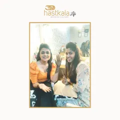 Another picture from the feature, this one with a client. Customizing designs based on my client's personality and story is the core of my work.